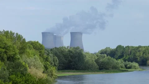 The Dampierre en Burly nuclear power plant in France, showing cooling towers Stock Footage 346697080