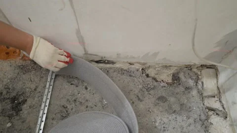 Damping tape for floor screed, application Damping tape for waterproofing floors Stock Footage 202244077