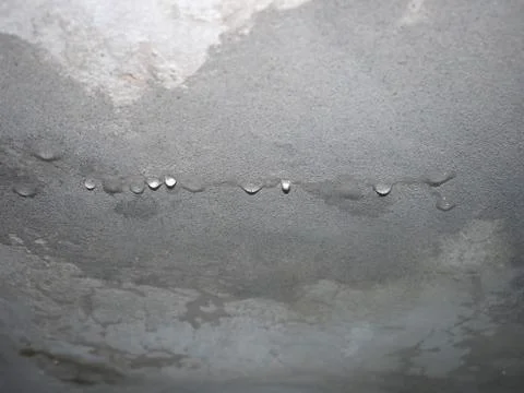 Dampness moisture on ceiling with drops of water infiltration Stock Photos