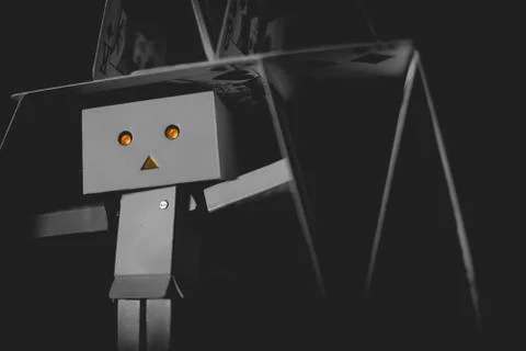 Danbo playing with cards Stock Photos