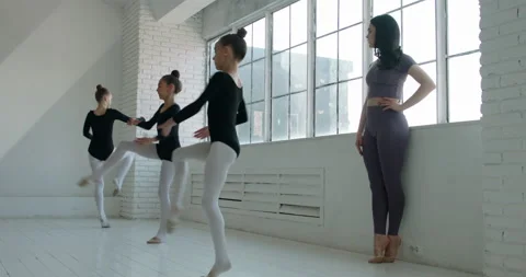 Dance class for teen girls. Kids learning basics of rhythmic gymnastics or Vídeos de archivo 154713599