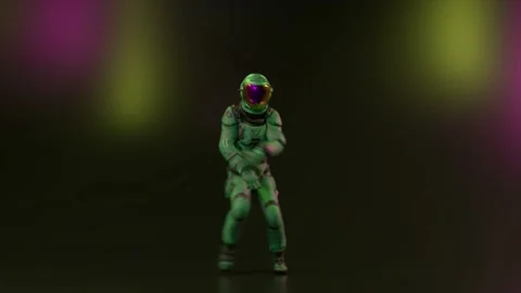 Dance concept. An astronaut in a large mirrored helmet dances in a nightclub Stock Footage 232860212