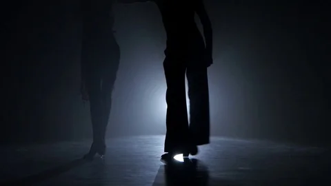 Dance couple demonstrating magnificent choreography of quickstep, black Stock Footage 74060341