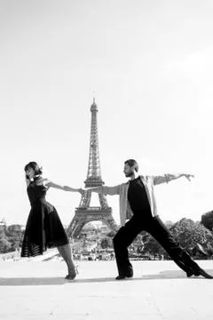 Dance couple in front of eifel tower in paris, france. beatuiful ballroom dance Stock Photos