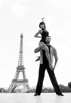 Dance couple in front of eifel tower in paris, france. beatuiful ballroom dance Stock Photos