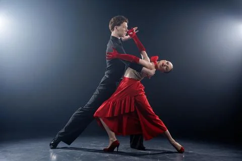 Dance Couple Performing Dramatic Partner Pose in Studio Lighting Stock Photos