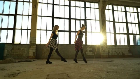 Dance duo performing contemporary dance in loft studio at sunset Stock Footage 118831000