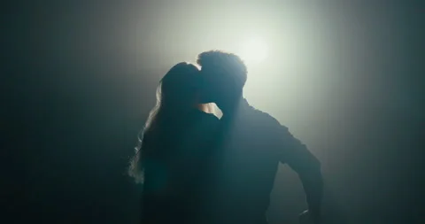 Dance of experienced partners in dark studio shadow of figure scene lit by lamp Stock Footage 161625678