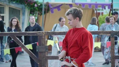 Dance of firemen reenactors with chains in medieval clothes 스톡 동영상 203703296