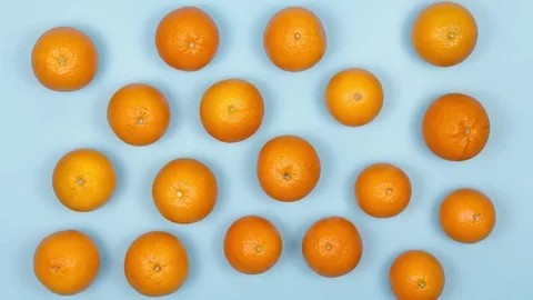 Dance of Fruit. Oranges Move in Different Directions on the Table. Blue. Vídeo Stock 74081821