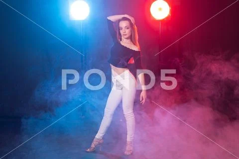 Dance, grace and elegance concept - young woman dancing bachata lady style in Stock Photos