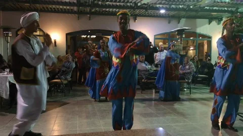 Dance group in colorful clothes performs a traditional Egyptian dance Stock Footage 126611065