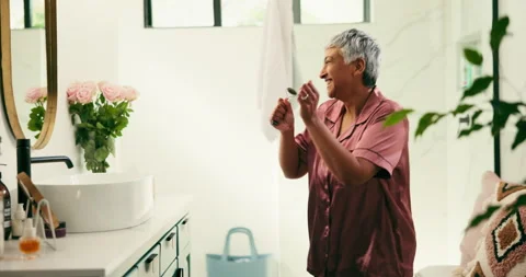 Dance, microphone and jade roller with woman in bathroom of home for morning Stock Footage 335892520