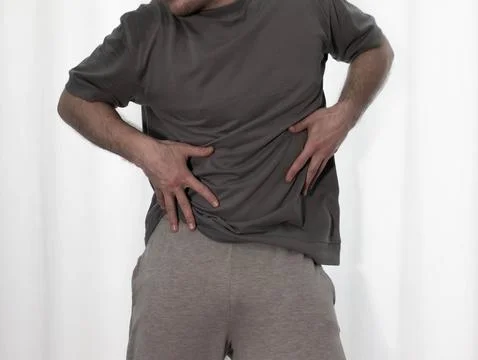 Dance in motion, pose of a man in hip-hop style clothes. Sports dancing guy.. Stock Photos