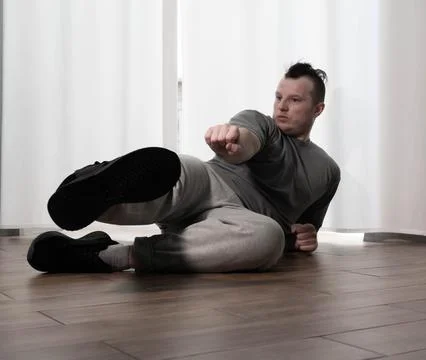 Dance in motion, pose of a man in hip-hop style clothes. Sports dancing guy.. Stock Photos