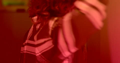 The dance moves of the dance instructor in the blinking of the light Stock Footage 231258234