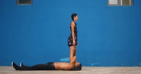 Dance partners demonstrating sensual dance pattern with acrobatics in slow Stock Footage 94825172