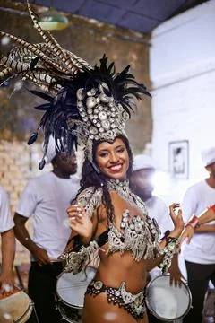 Dance, portrait and exotic woman dancer performing with a band at mardi gras or Stock Photos