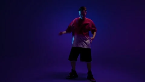 Dance pose in purple studio light Stock Footage 345601652