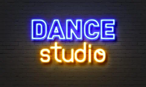 Dance studio neon sign on brick wall background. Stock Illustration