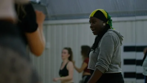 Dance teacher watching her class learning a new dance step Stock Footage 118934171