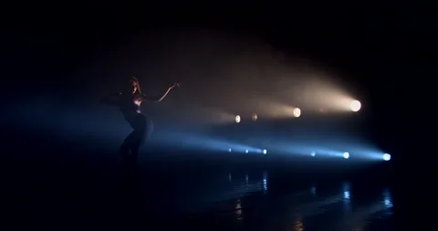 Dancer against the backdrop of bright spotlights Stock-Footage 149861601