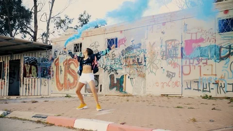 Dancer with blue smoke dancing Stock Footage 102722944