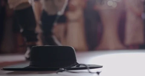 Dancer in boots with spurs dancing in front of the audience in the spotlight. Video stock 108918373