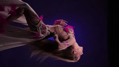 Dancer in bright oriental costume dancing belly dance Stock Footage 291136422
