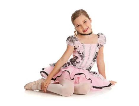 Dancer: cute ballet dancer sits on the floor Stock Photos