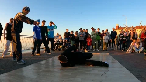 The dancer dances the bottom break, slow motion video of breakdancing Stock Footage 201545693