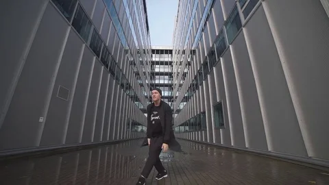 Dancer dancing with cityscape on the background Stock Footage 69986263