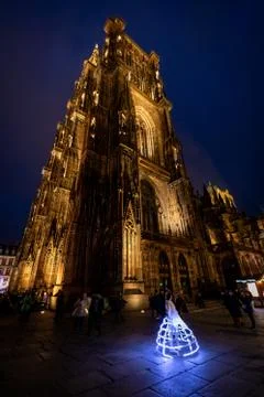 A dancer dancing in front of Strasbourg Cathedral at night Stock Photos