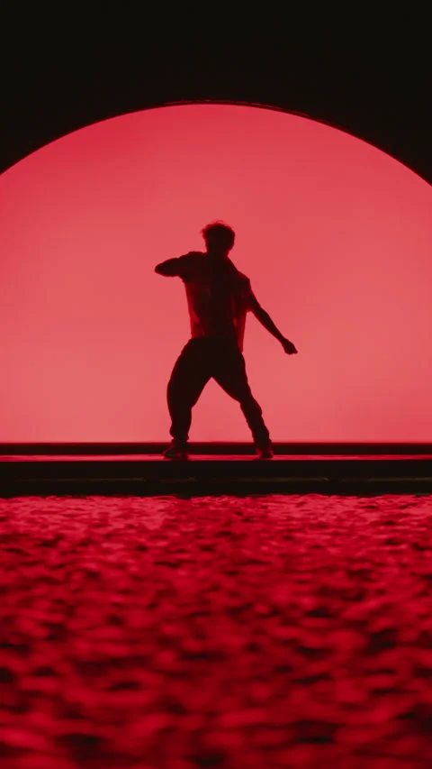 Dancer On Dark Stage With Red Background Stock Footage 255538200