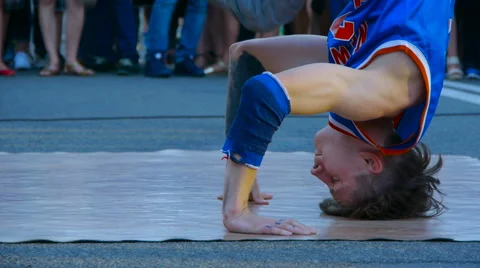 Dancer demonstrates elements of break dance in the street, style of street dance Video stock 66878651