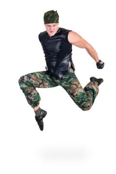 Dancer dressed soldier jumping Stock Photos