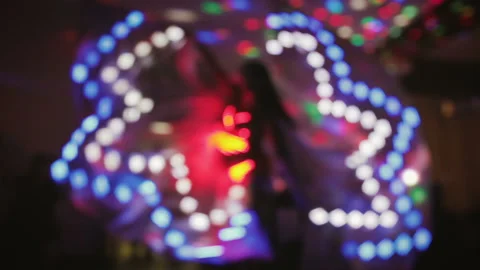 Dancer in elegant, luminous dress performs at night Stock Footage 101569737