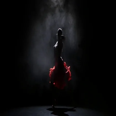 Dancer girl in beautiful dress in the studio on a dark background, smoke Stock Footage