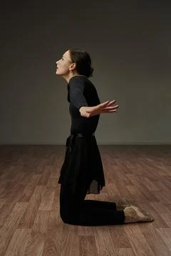 Dancer gracefully arched her back and spread her arms. beauty and grace of dance Stock Photos