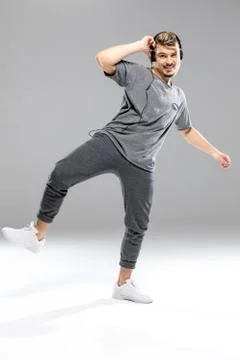 Dancer in headphones posing Stock Photos