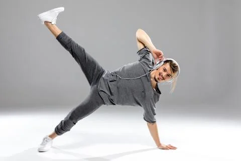 Dancer in headphones posing Stock Photos