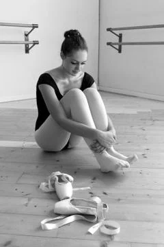 Dancer off her pointe shoes Stock Photos