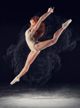 Dancer high jump and the explosion of white dust Stock Photos