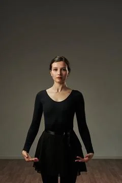 Dancer holds her hands at the level of her hips, pointing her hands inward Stock Photos