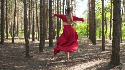 Dancer improvisation with jumps. Skill ballerina woman in red dress dancing  Stock-Footage 109680032