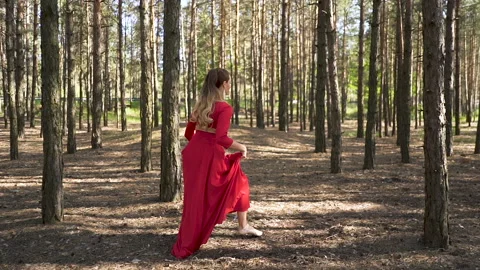 Dancer improvisation with jumps. Skill ballerina woman in red dress Video stock 109680363