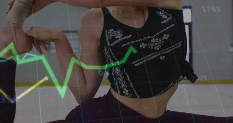 Dancer initiating split as graphs overlaying, guiding scorpion stretch for 库存影片 317869983