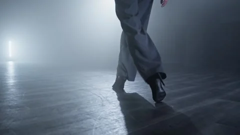 Dancer legs walking through dark studio. Elegant female heels dancer at stage Stock Footage 271139850