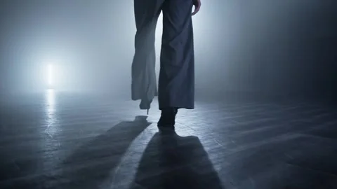Dancer legs walking through dark studio. Elegant female heels dancer at stage Stock Footage 274054495