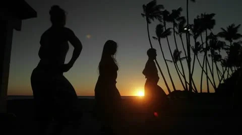 Dancer perform a traditional dance in front of the sunset. Stock Footage 9549077